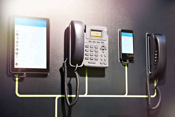 Office telephones and modern smartphones and tablets on the web
